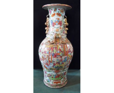 A large 19th century Cantonese vase of two handled ovoid form, typically decorated with flowers, figures and butterflies, 60c