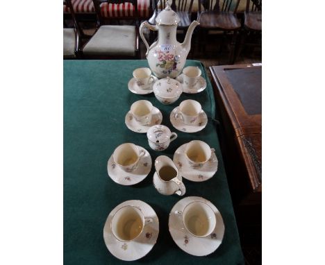 A Royal Copenhagen Frijsenborg coffee service, comprising: coffee pot, covered sugar bowl, cream jug and eight cups and sauce