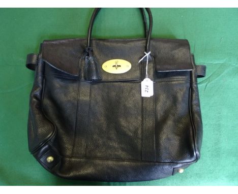 A ladies Mulberry black leather handbag, having internal zipped pocket, a tag bearing the number 226686, with external padloc