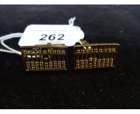 A pair of 14ct gold cufflinks, each formed as an abacus with numerous moveable beads.