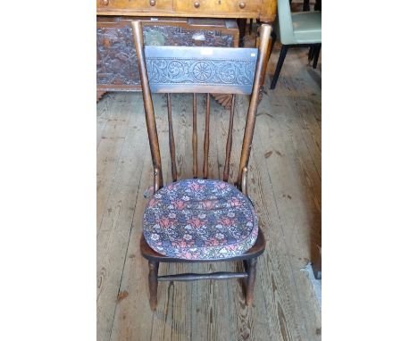 A 19th century oak stick back nursing chair.