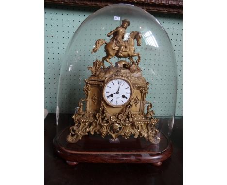 A late 19th century French mantle clock in a gilt metal case with equestrian surmount, the dial bearing Romam numerals and th