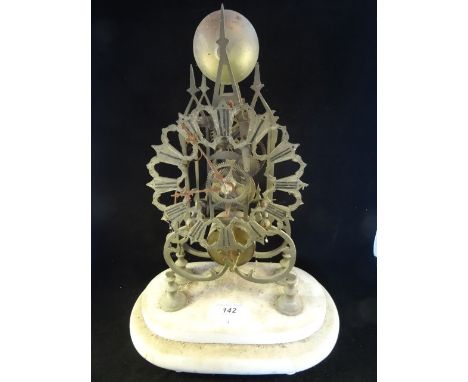 A Victorian Gothic-style skeleton clock, in need of restoration, on stepped oval marble base, the dial bearing Roman numerals