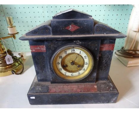 A Victorian slate and marble mantle clock, the dial bearing Arabic numerals, 28cm wide.
