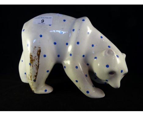 A Plichta London ceramic model of a Polar Bear, hand painted with blue dots, printed mark to base, 18cm tall x 23cm wide.
