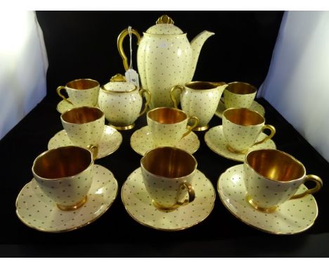 A Art Deco period Carlton Ware coffee set, decorated with hand painted polka dots on cream ground with gilt finish, comprisin