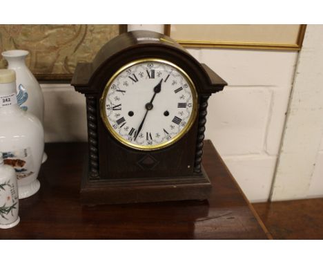 An oak cased twin hole mantle clock by Gustav Becker