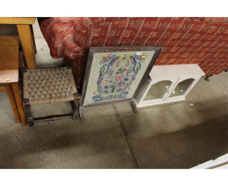 An oak framed and needlework fire screen; a string topped stool and a bathroom cabinet