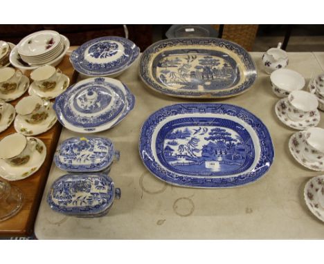 Two blue and white old willow pattern meat plates and two tureens and two sucrier