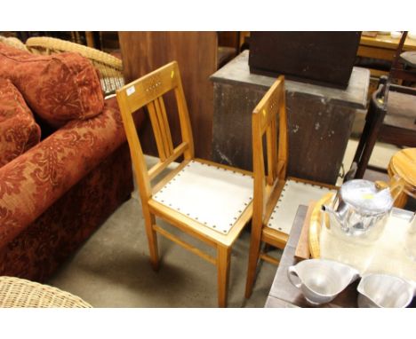 A pair of continental oak and mother of pearl inlaid bedroom chairs