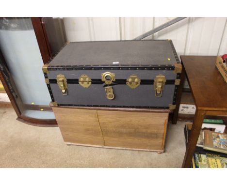 A travelling trunk; and a storage chest 