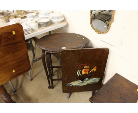 A nest of two walnut occasional tables and an oak and decorated firescreen
