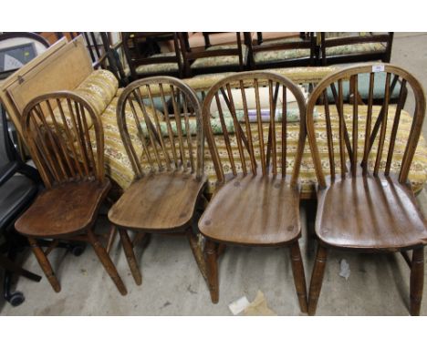 A set of four elm back stick back kitchen chairs