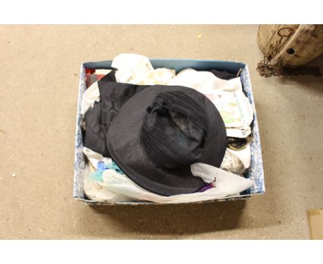 A box of various textiles; a ladies hat etc.