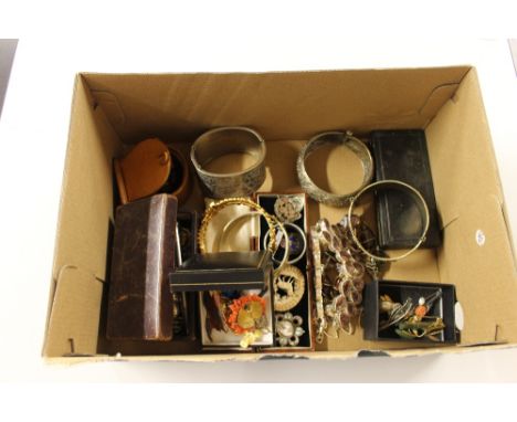 A box containing various bangles, silver and white metal jewellery, a silver plated propelling pencil, a Netsuke in the form 