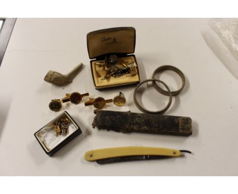 A box containing a cut throat razor, cuff-links a clay pipe etc. 