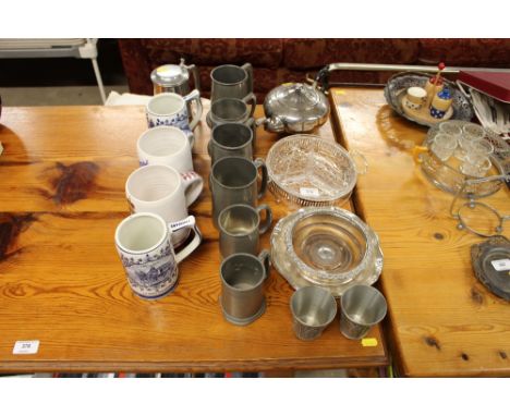 A quantity of pottery and pewter tankards; a silver plated teapot
