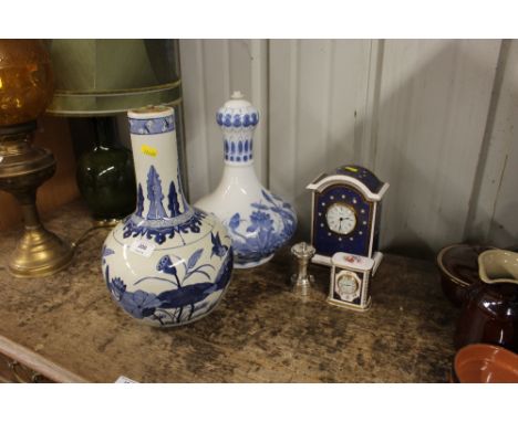 A Spode china mantel clock together with one other smaller; a silver plated pepperette; and two blue and white table lamp bas