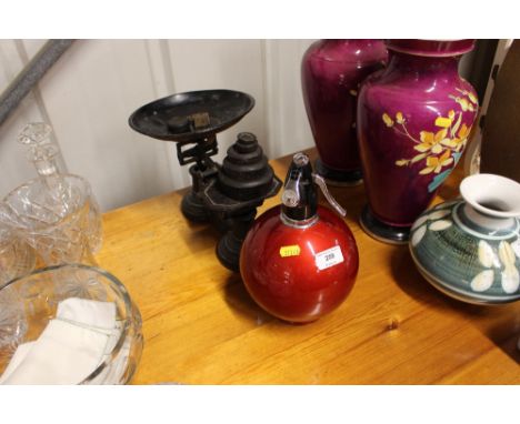 A Soda Syphon and a set of scales and weights