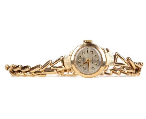 LADY'S AVIA NINE CARAT GOLD MANUAL WIND WRIST WATCH,the round cream dial with applied baton and Arabic hour markers, outer se