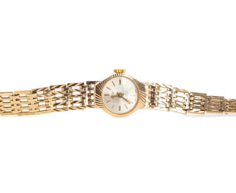 LADY'S UNO NINE CARAT GOLD MANUAL WIND WRIST WATCH,the round silver coloured dial with applied baton hour markers, 16mm case,