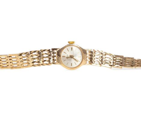 LADY'S UNO NINE CARAT GOLD MANUAL WIND WRIST WATCH,the round silver coloured dial with applied baton hour markers, 16mm case,