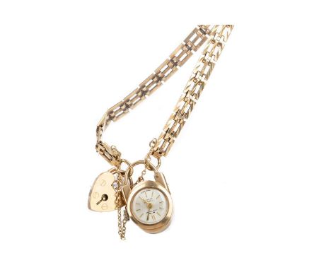 LADY'S NINE CARAT GOLD MANUAL WIND BRACELET WATCH,the small Craftsman fob to a gatelink bracelet with nine carat gold heart s