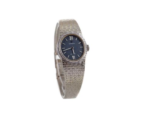 LADY'S OMEGA DE VILLE EIGHTEEN CARAT WHITE GOLD MANUAL WIND WRIST WATCH,the oval blue dial with applied Roman hour markers, 2