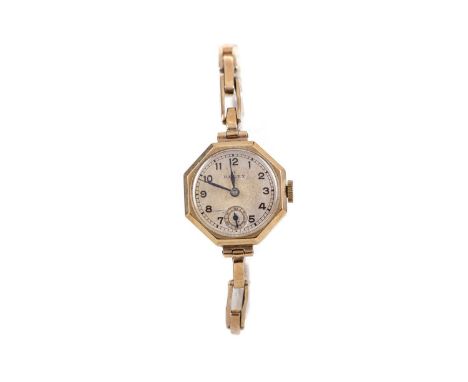 LADY'S ROLEX NINE CARAT GOLD MANUAL WIND WRIST WATCH,the round cream dial with Arabic hour markers, outer railroad seconds tr