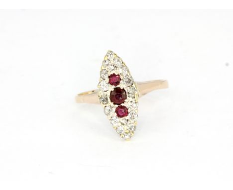 A 9ct yellow gold (stamped 9ct) ruby and diamond set ring, (P.5)cm.