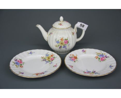 A Royal Worcester 'Roanoke' pattern teapot and two tea plates.