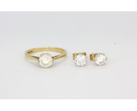 A 9ct yellow gold stone set solitaire ring, (J).