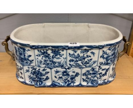 A continental porcelain two handled trough, H55cm.