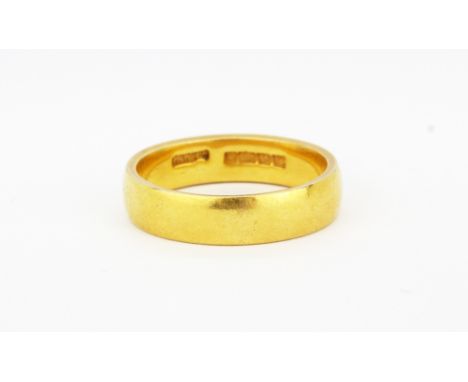 A 22ct yellow gold wedding band, (O), approx. 7.6gr.&nbsp;