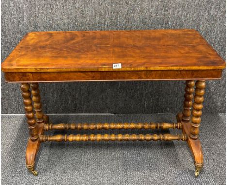 A 19th C bobbin turned stretcher table, 104 x51 x 70cm.