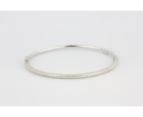An 18ct white gold bangle, L. 6.5cm, approx. 4.5gr.&nbsp;