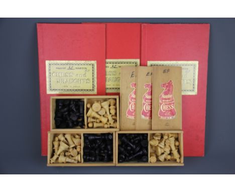 Three boxed Staunton wood chess sets and boards.