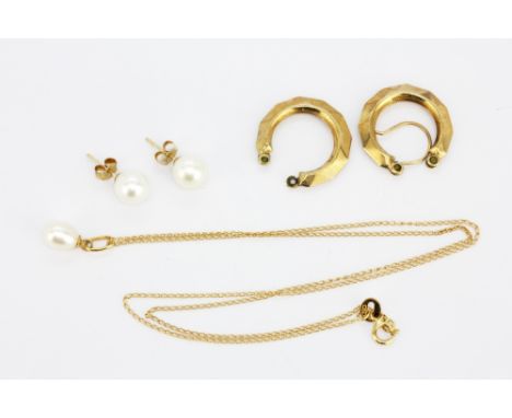 A pair of 9ct yellow gold pearl set stud earrings, a similar 18ct yellow gold (stamped 750) pendant and chain and a further p