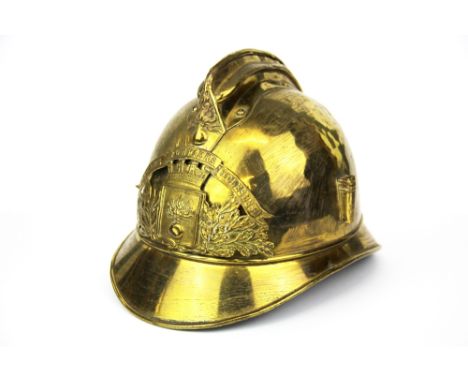 An antique gilt brass fireman's helmet.