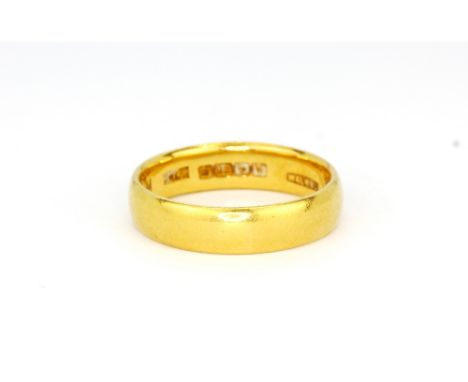 A 22ct yellow gold wedding band, (M), approx. 5.1gr.&nbsp;