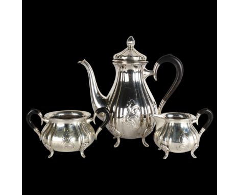 An Art Nouveau Danish silver 3-piece tea set, retailed by Heimburger, circa 1937, baluster form, with relief embossed foliate