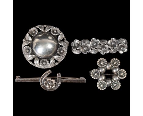A group of similar Danish silver floral jewellery, makers include Niels Erik From and Hermann Siersbol, comprising 4 brooches