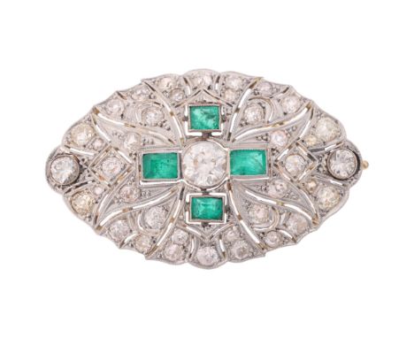 An Art Deco emerald and diamond plaque brooch, circa 1920, of shaped oval pierced form, centrally millegrain set with a 0.90c