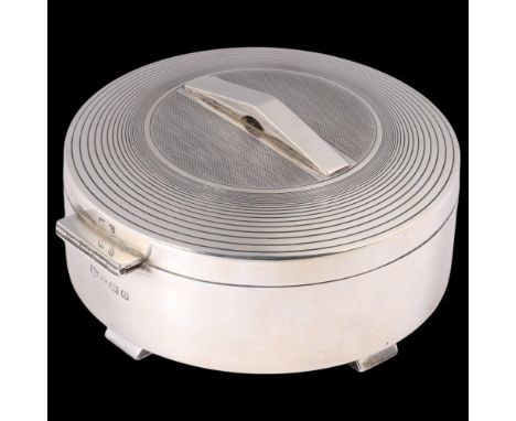 An Art Deco George VI silver box, S Blanckensee & Sons Ltd, Birmingham 1938, circular form with geometric pyramid handle, eng