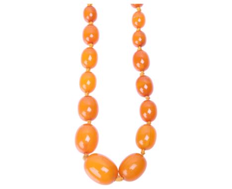 A Vintage single-strand graduated butterscotch amber bead necklace, beads ranging from: 22.4mm - 9.3mm, 70cm, 45.9g . Conditi