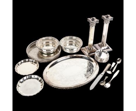 A quantity of silver plate, including pair of Corinthian column table candlesticks, pair of wine bottle coasters, set of 7 Da