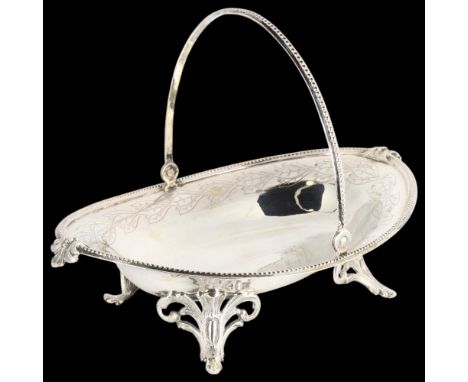 An Antique German silver swing-handled sweetmeat basket, marked Peter, oval form, with bright-cut and engine turned decoratio