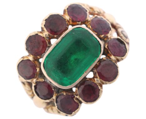 An Antique Georgian green paste and garnet cluster mourning ring, circa 1820, set with octagonal step-cut green paste, surrou
