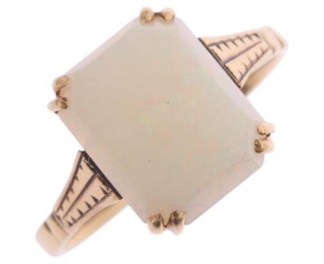 A Vintage 9ct gold single stone opal dress ring, set with rectangular cabochon opal, setting height 10.2mm, size J, 1.7g . Co
