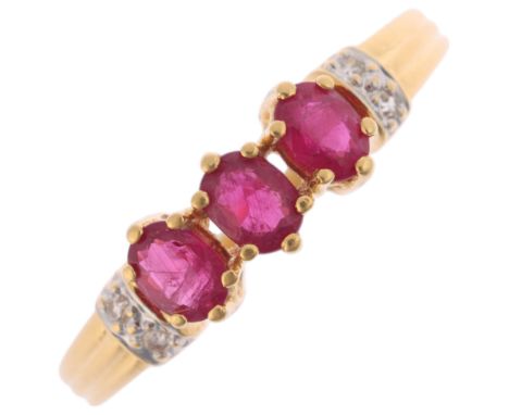 An 18ct gold ruby and diamond dress ring, claw set with oval mixed-cut rubies and single-cut diamonds, setting height 5.3mm, 